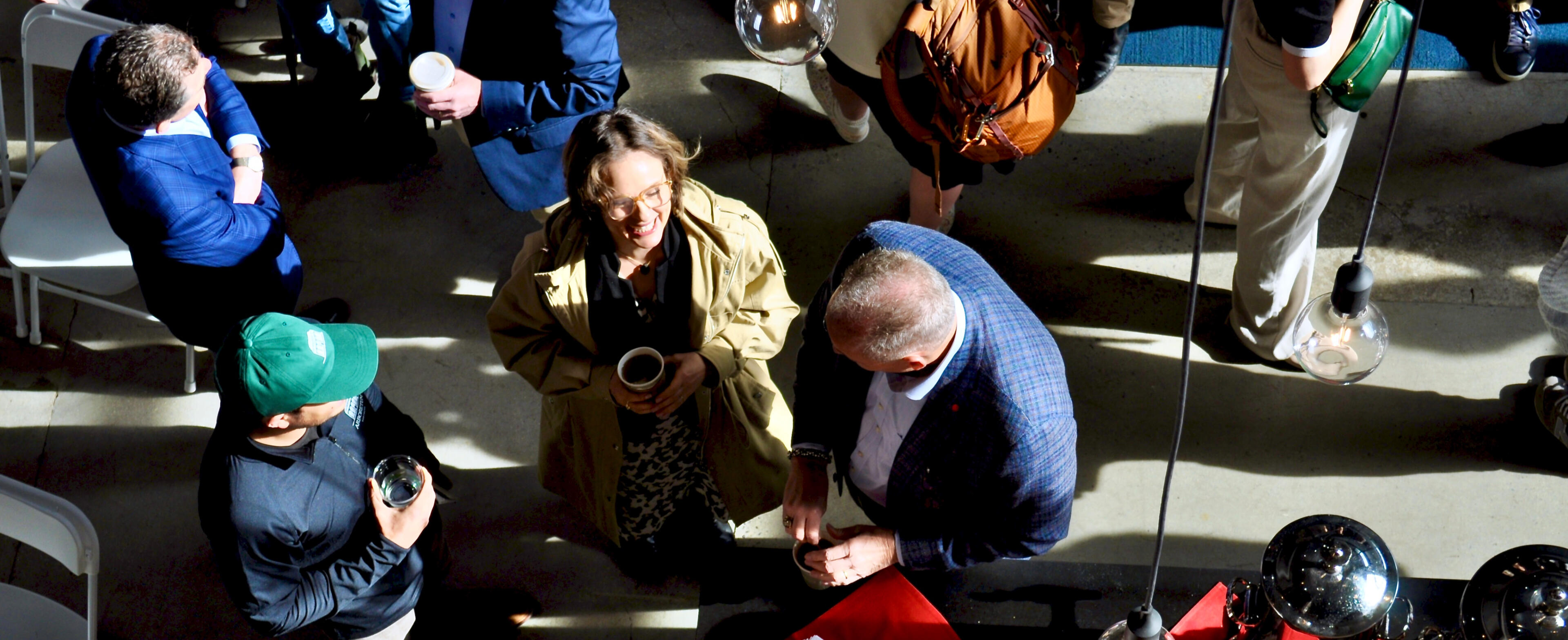 a woman and man talking with coffee